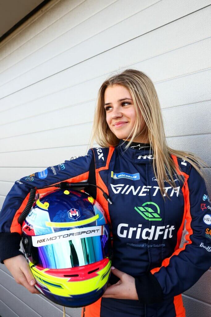 Holly in racing suit Holly Miall teenage racing driver